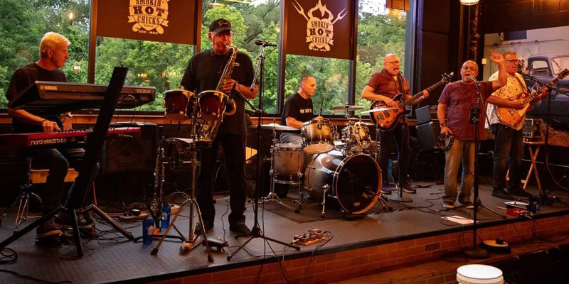 The Roll the Dice Band playing music at a venue
