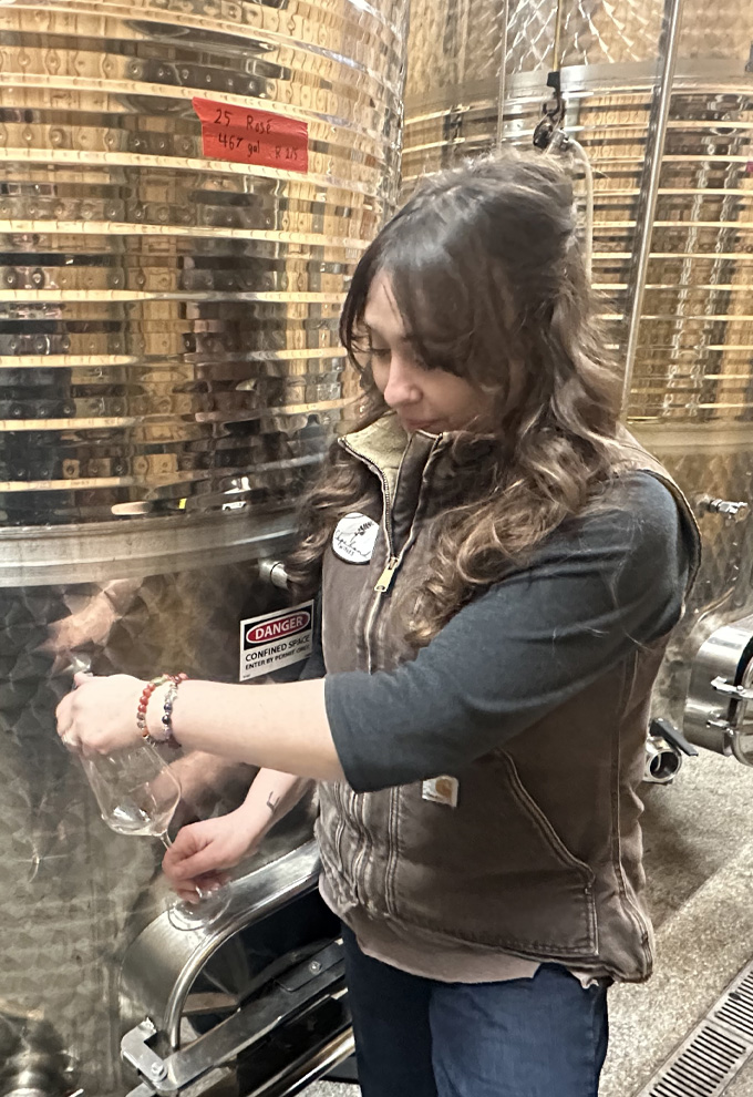 Alexandra Bond in the wine cellar